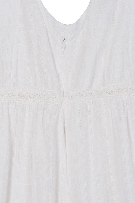 Embroidered white V neckline tiered dress